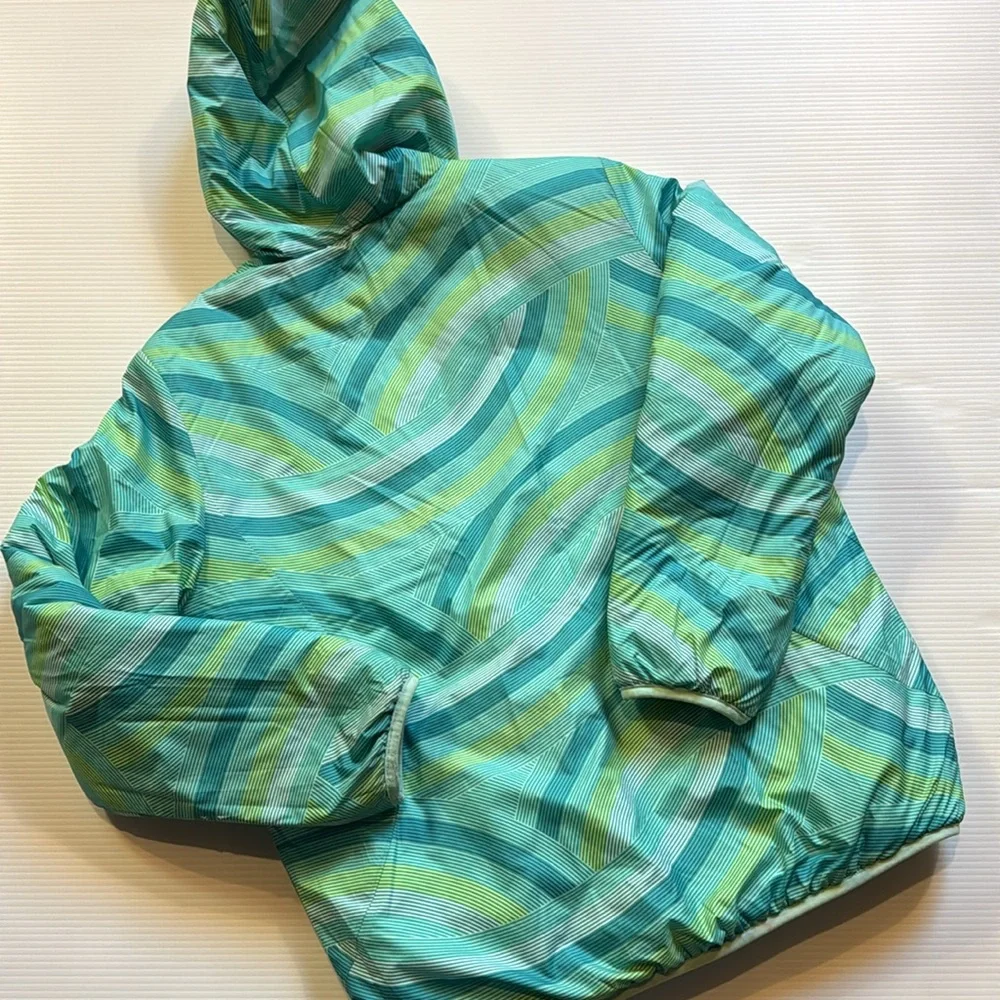 The North Face reversible puffers jacket.  Green, yellow, white swirl. Girls XL